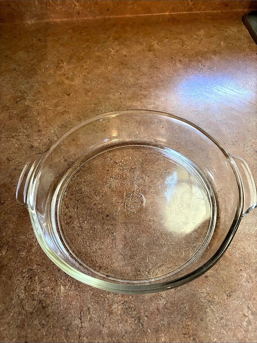 Pyrex 221 Pie Plate / Baking Dish / Casserole Clear pre owned small chip in hand